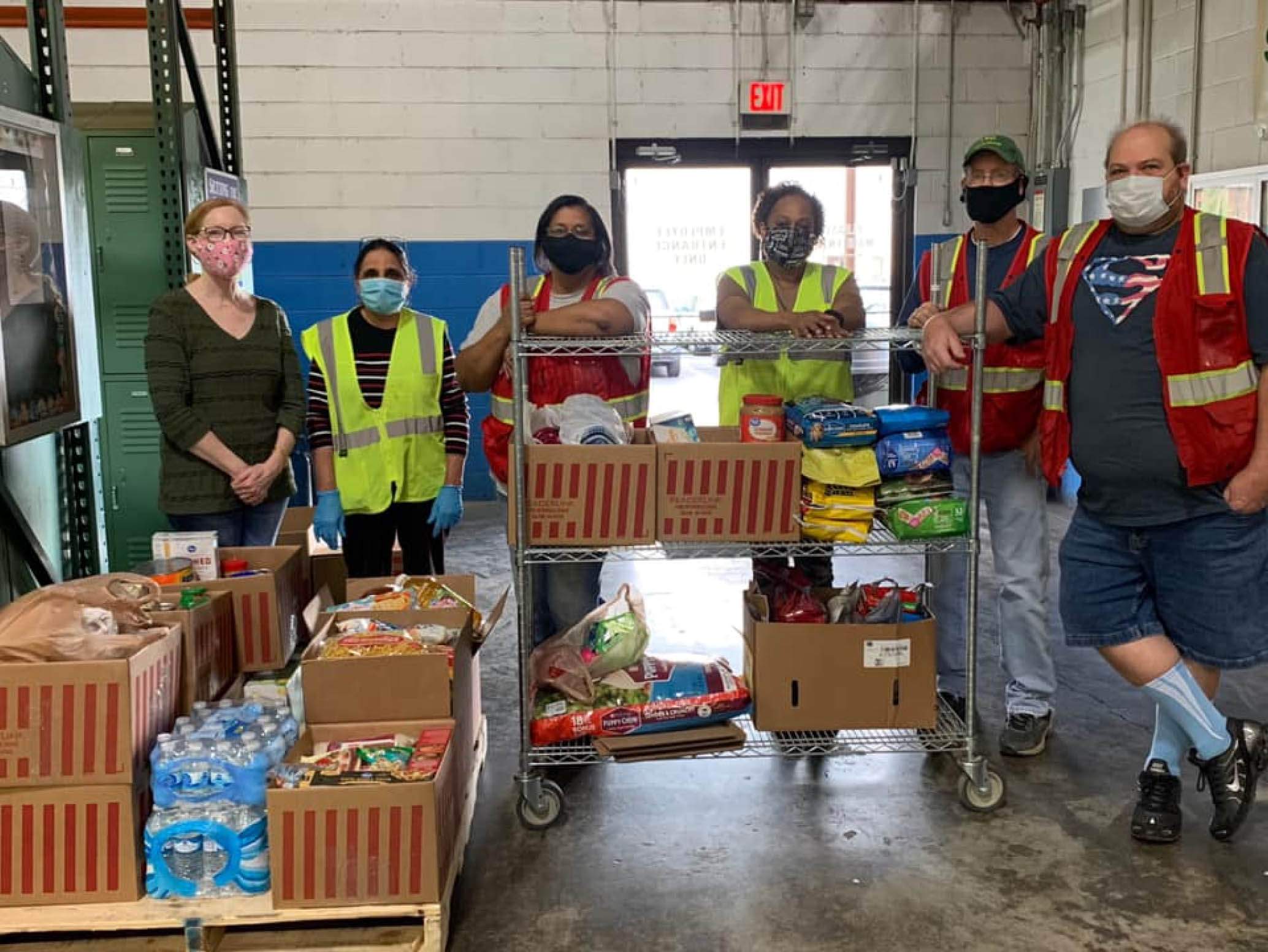 ReaderLink volunteers with food donations at Feeding America