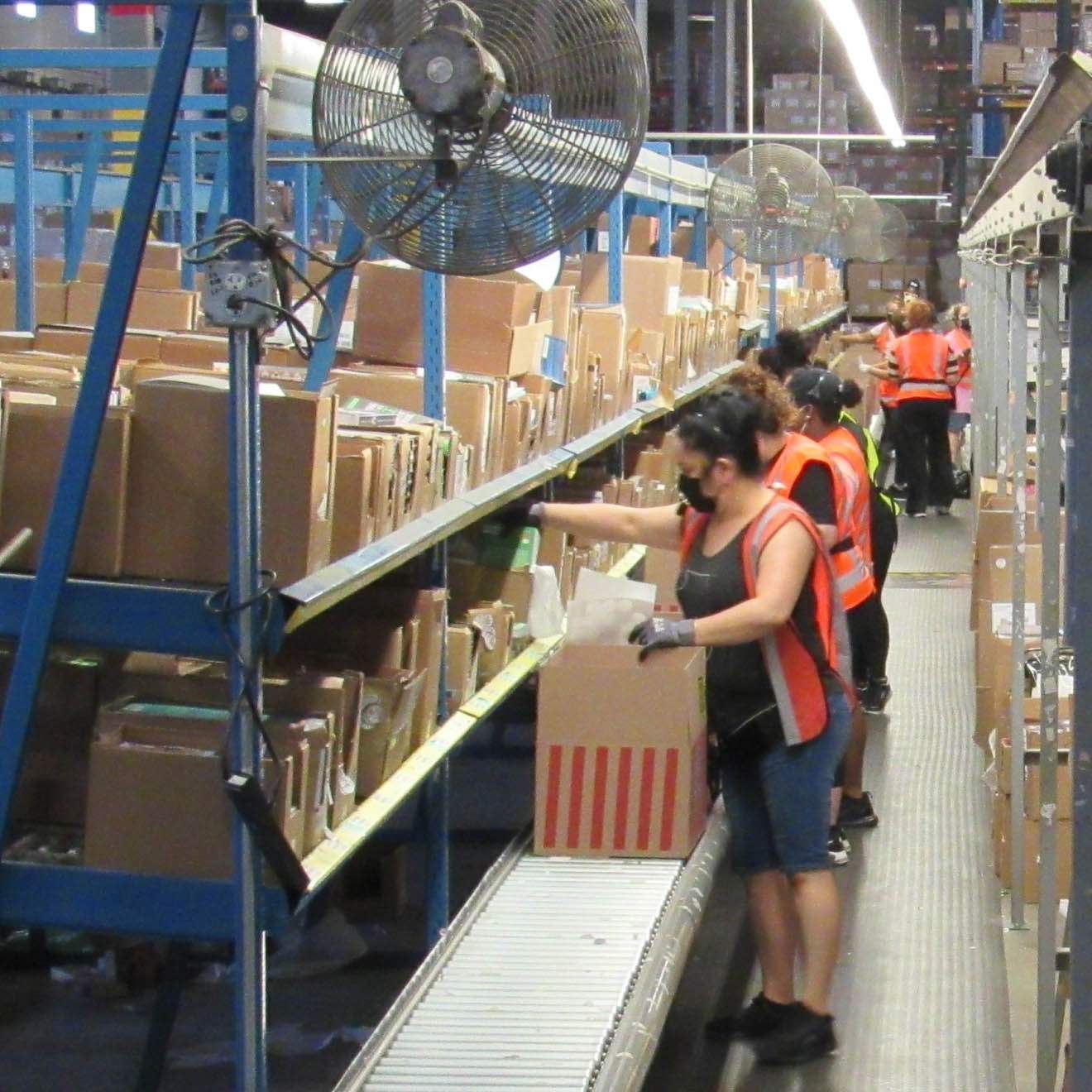 ReaderLink employees packing boxes at the warehouse